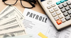 payroll forum with dollars and calculator